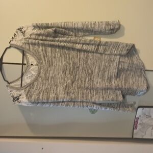 Adorable grey with lace embroidered back. Size M